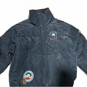 Black puffer jacket with embroidered patches